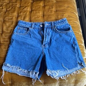 Frayed medium wash denim shorts
